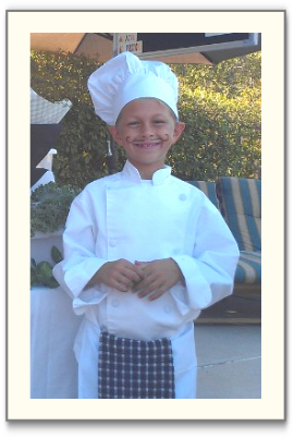 Little boy dressed as a chef