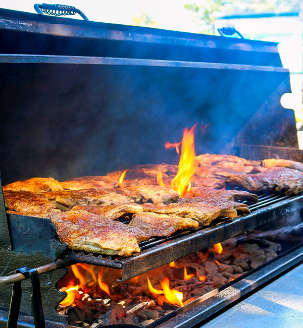 Ribs on the grill with flames, catering services, Los Angeles County